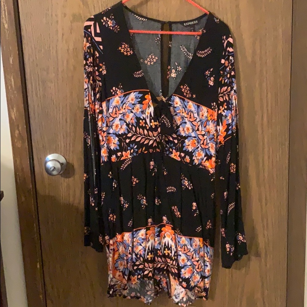 Express long sleeved romper with tie front.